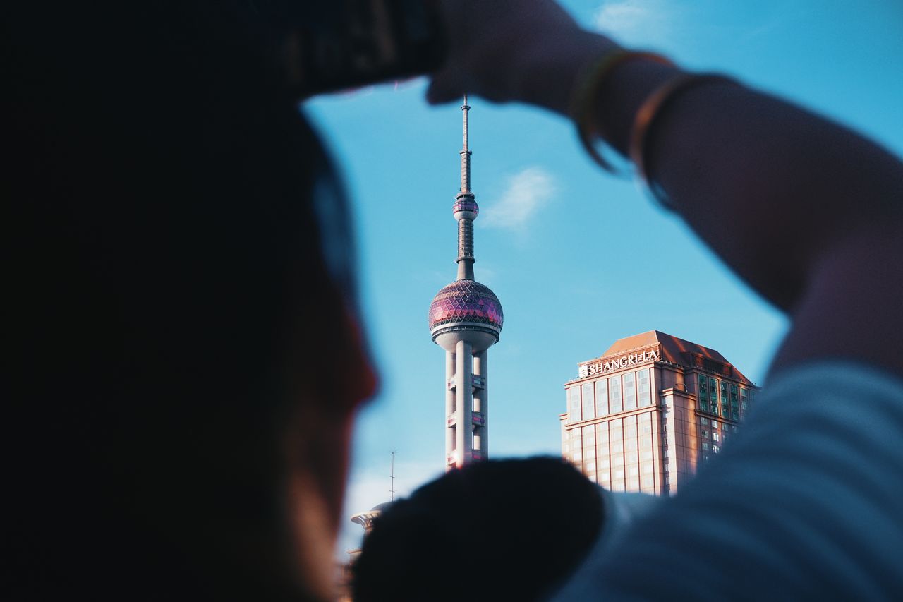 A unique view of the Pearl Tower taken from street level in Shanghai, China.